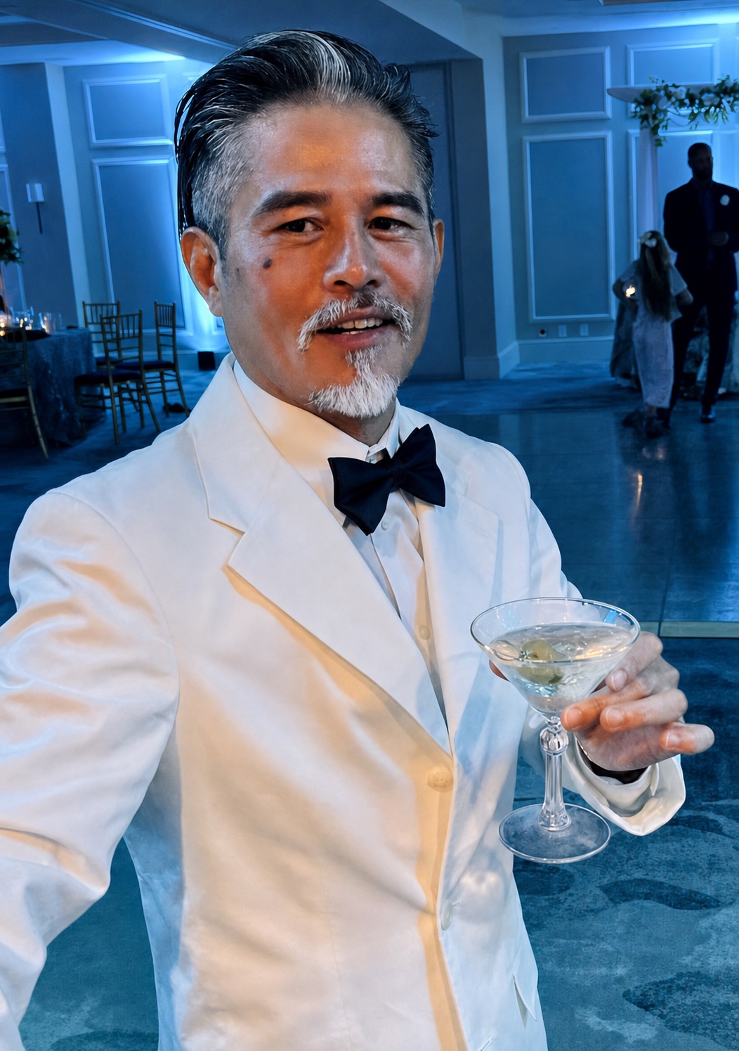 Vincent Nguyen dressed in a white tuxedo at an evening event