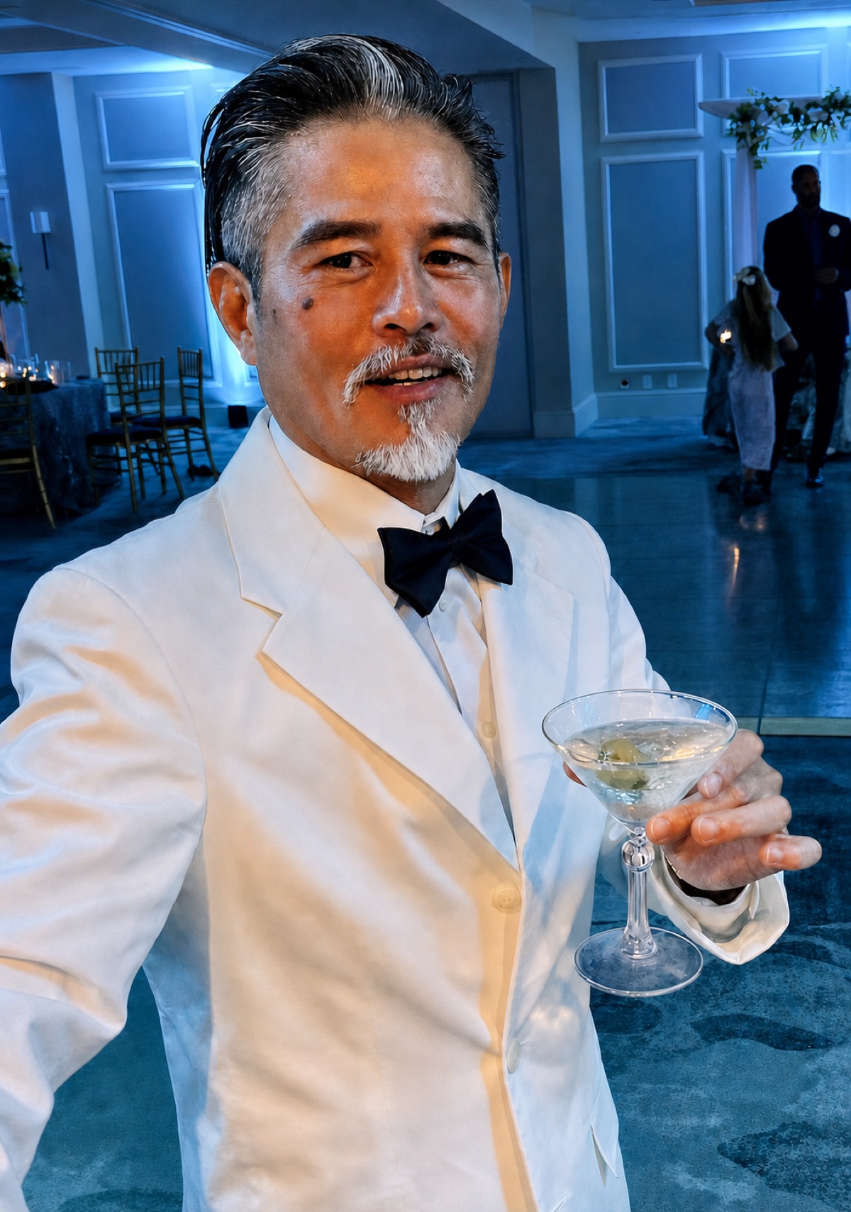 Vincent Nguyen dressed in a white tuxedo at an evening event