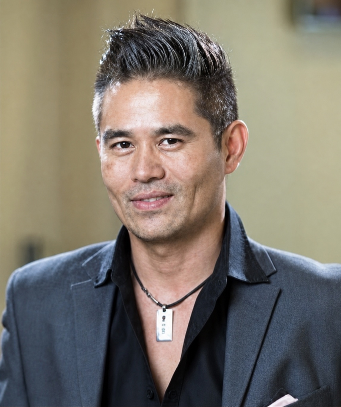 Portrait of Vincent Nguyen in a dark blazer
