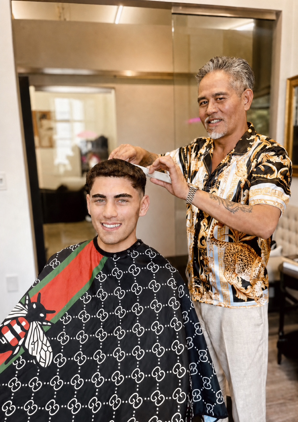 Vincent Nguyen shaping a client's short haircut in his salon